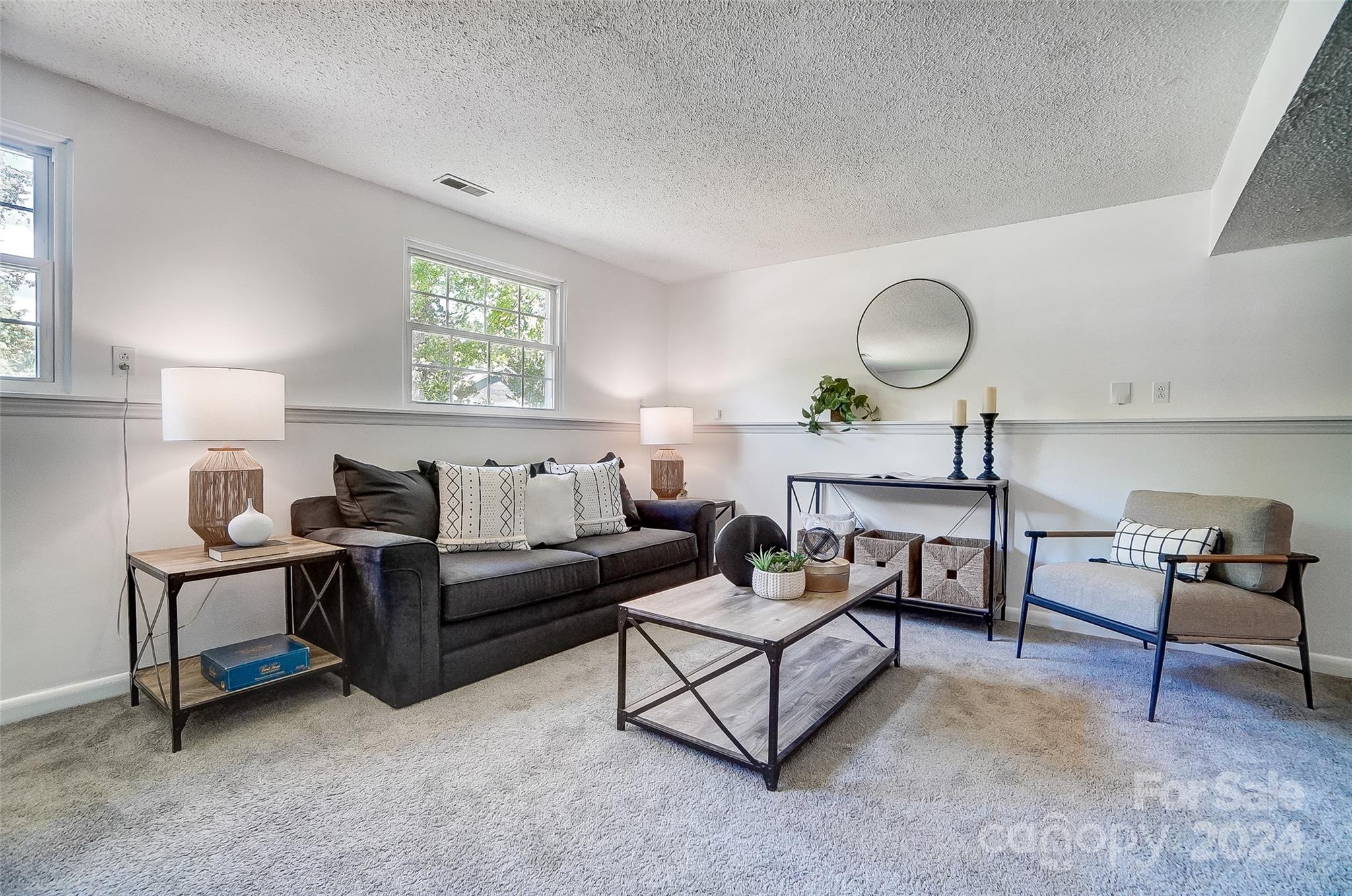 2236 Rice Planters Road Charlotte, NC 28273 - Photo 29 of 43 a living room with furniture and a large window