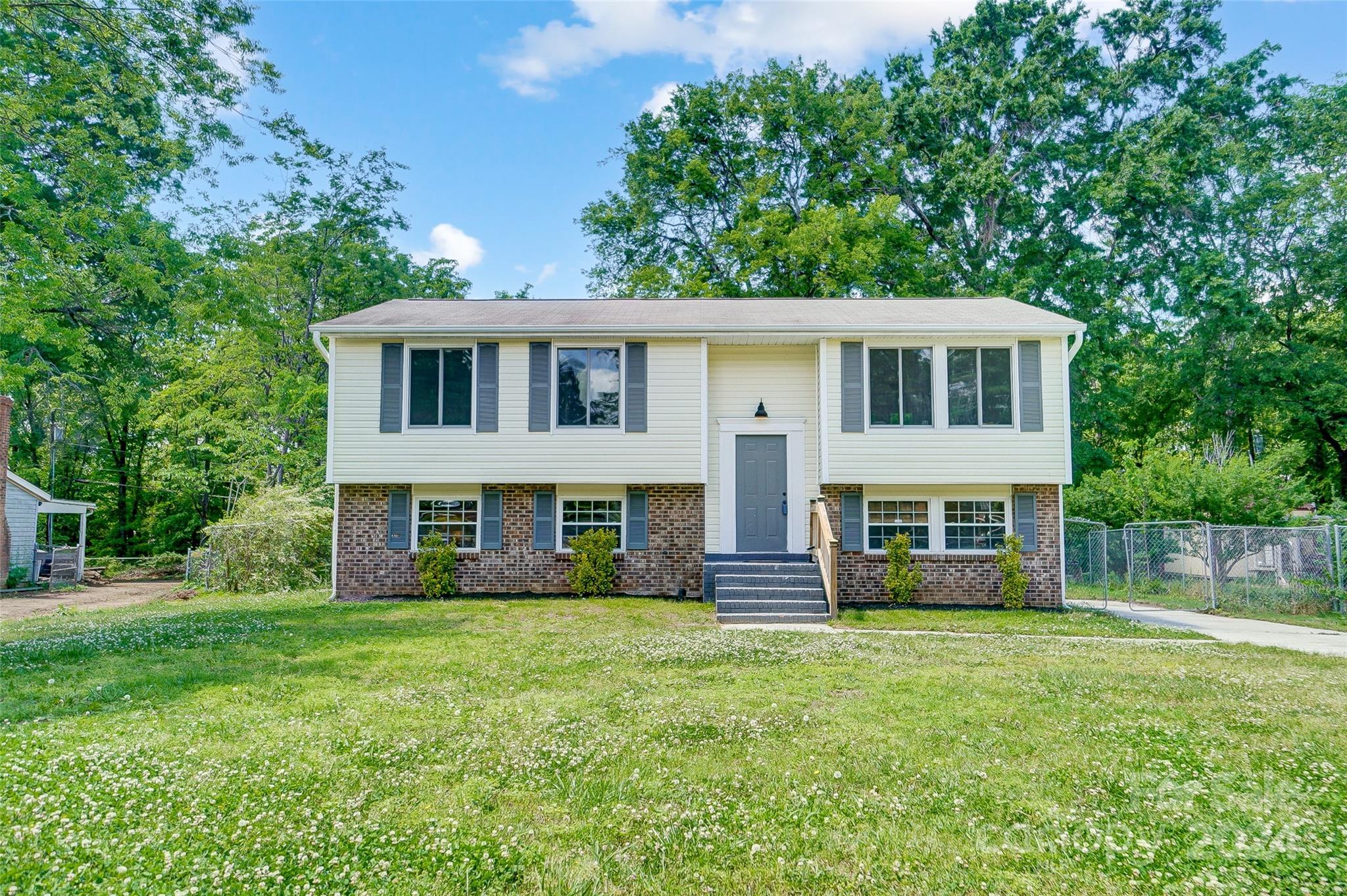 2236 Rice Planters Road Charlotte, NC 28273 - Photo 3 of 43 a front view of a house with a yard