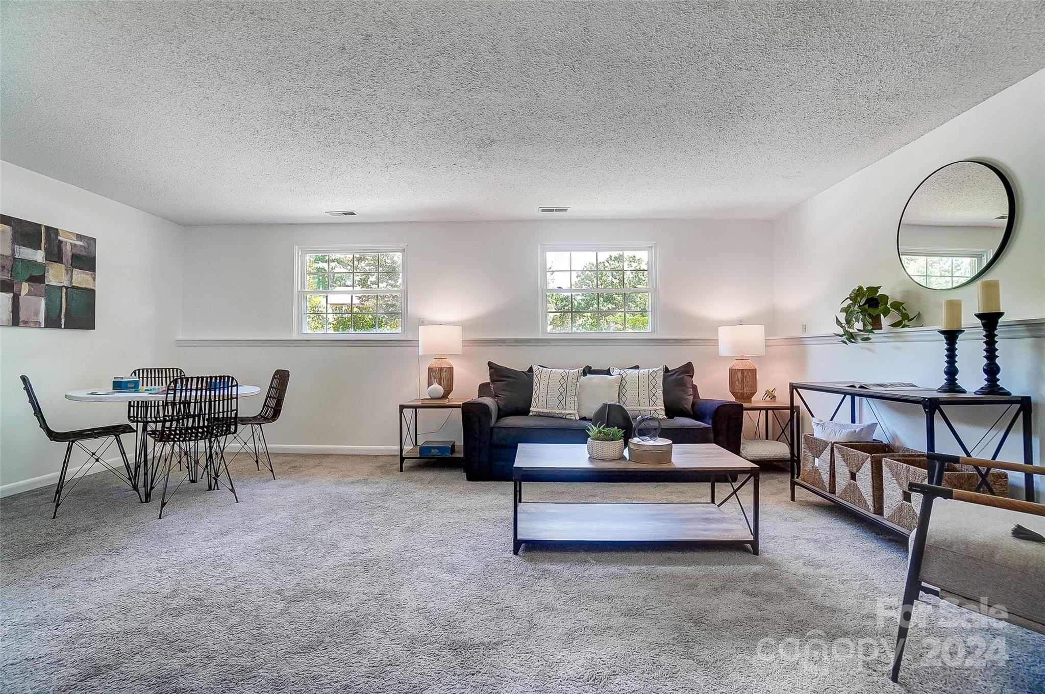 2236 Rice Planters Road Charlotte, NC 28273 - Photo 34 of 43 a living room with furniture and a potted plant