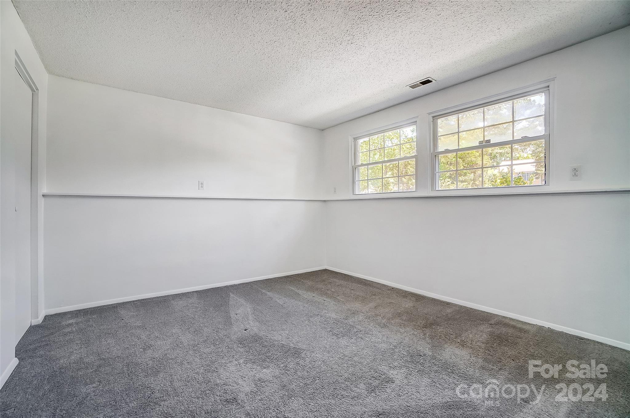2236 Rice Planters Road Charlotte, NC 28273 - Photo 36 of 43 an empty room with a empty space and windows