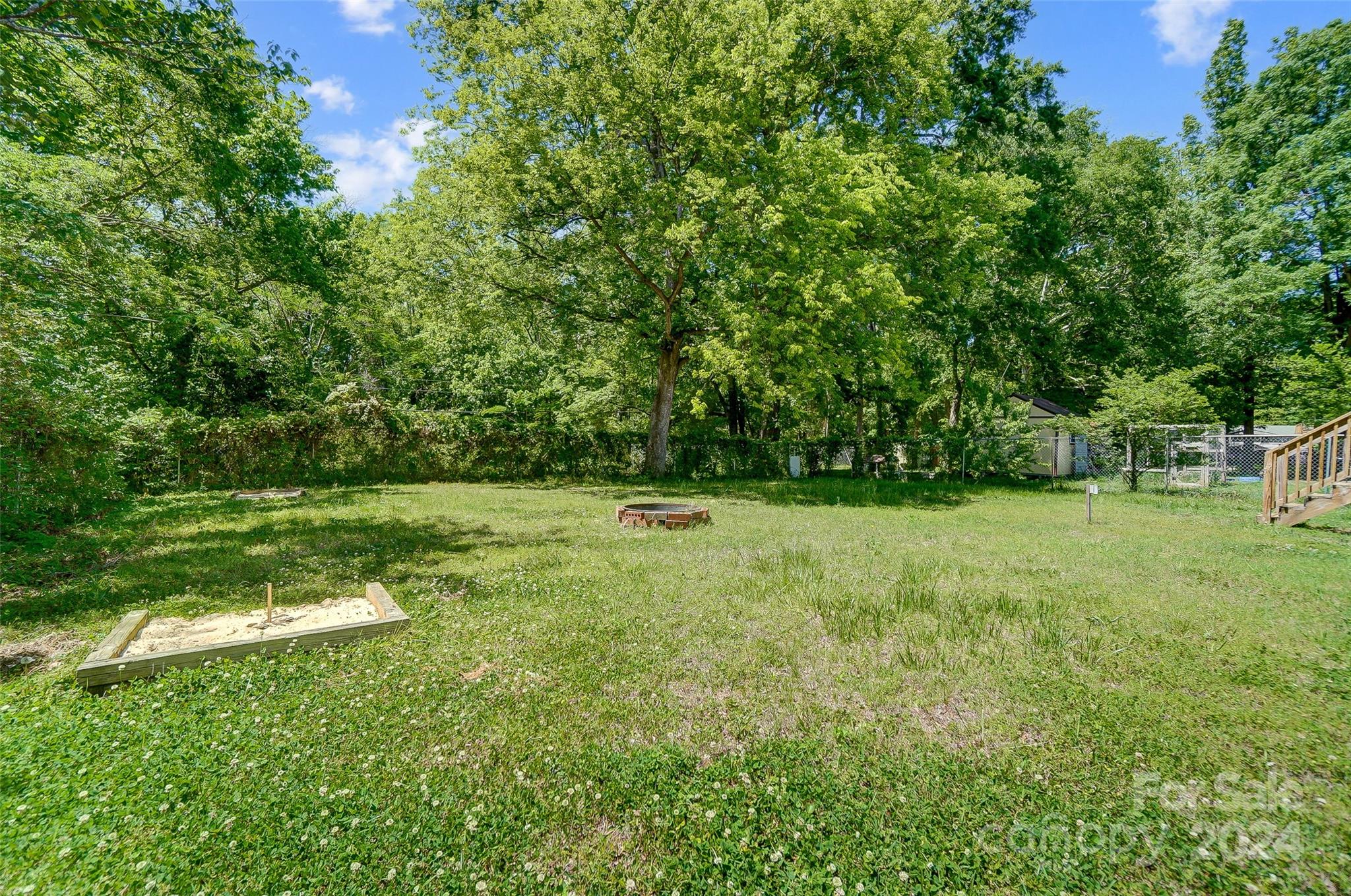 2236 Rice Planters Road Charlotte, NC 28273 - Photo 41 of 43 a view of a green field with wooden fence