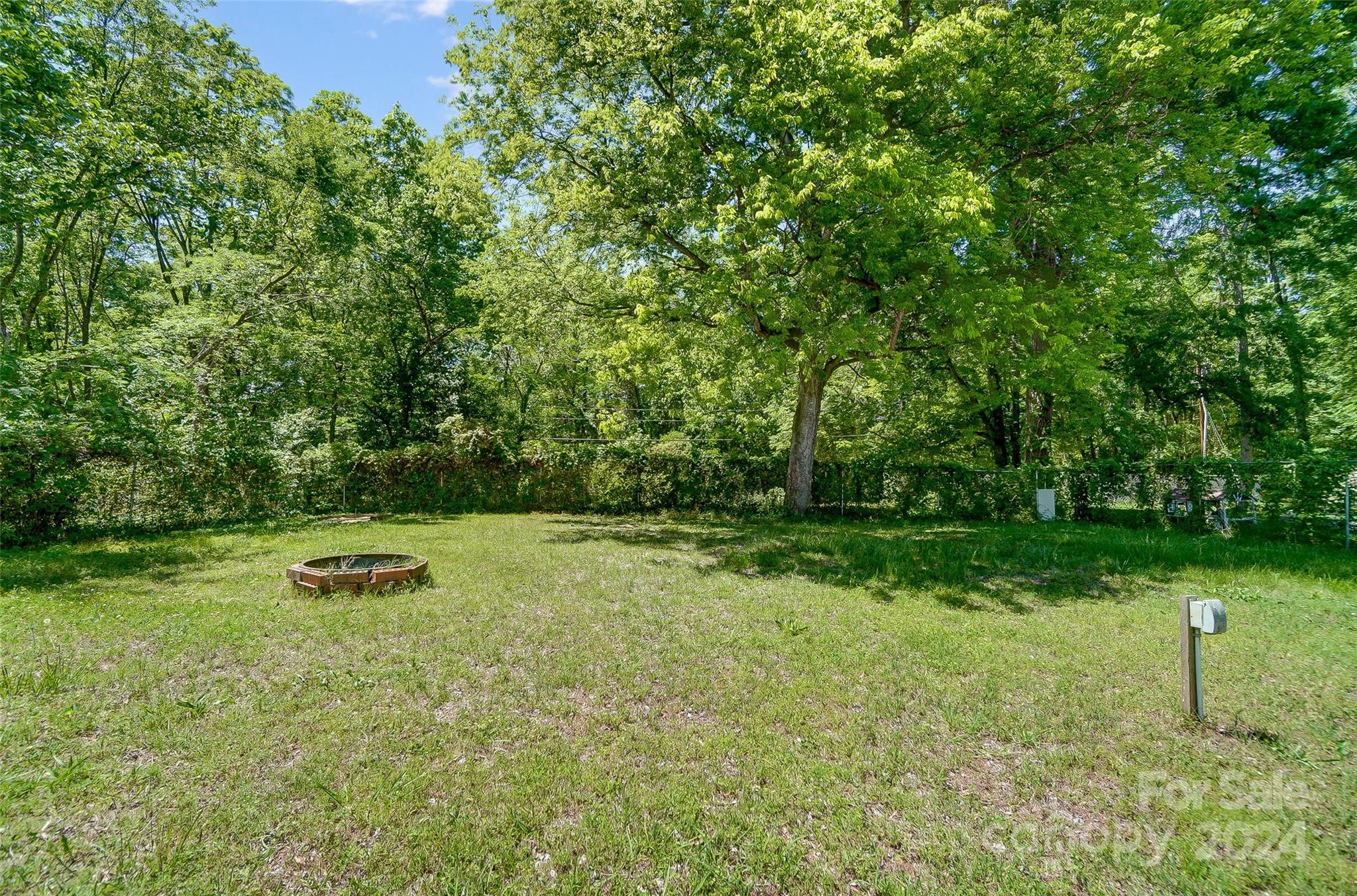 2236 Rice Planters Road Charlotte, NC 28273 - Photo 42 of 43 a backyard of a house with lots of green space