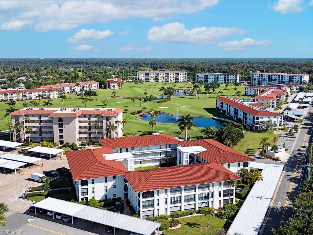 53 High Point Circle West, Unit 101 Naples, FL 34103 - Photo 1 of 18 a view of a city & an ocean