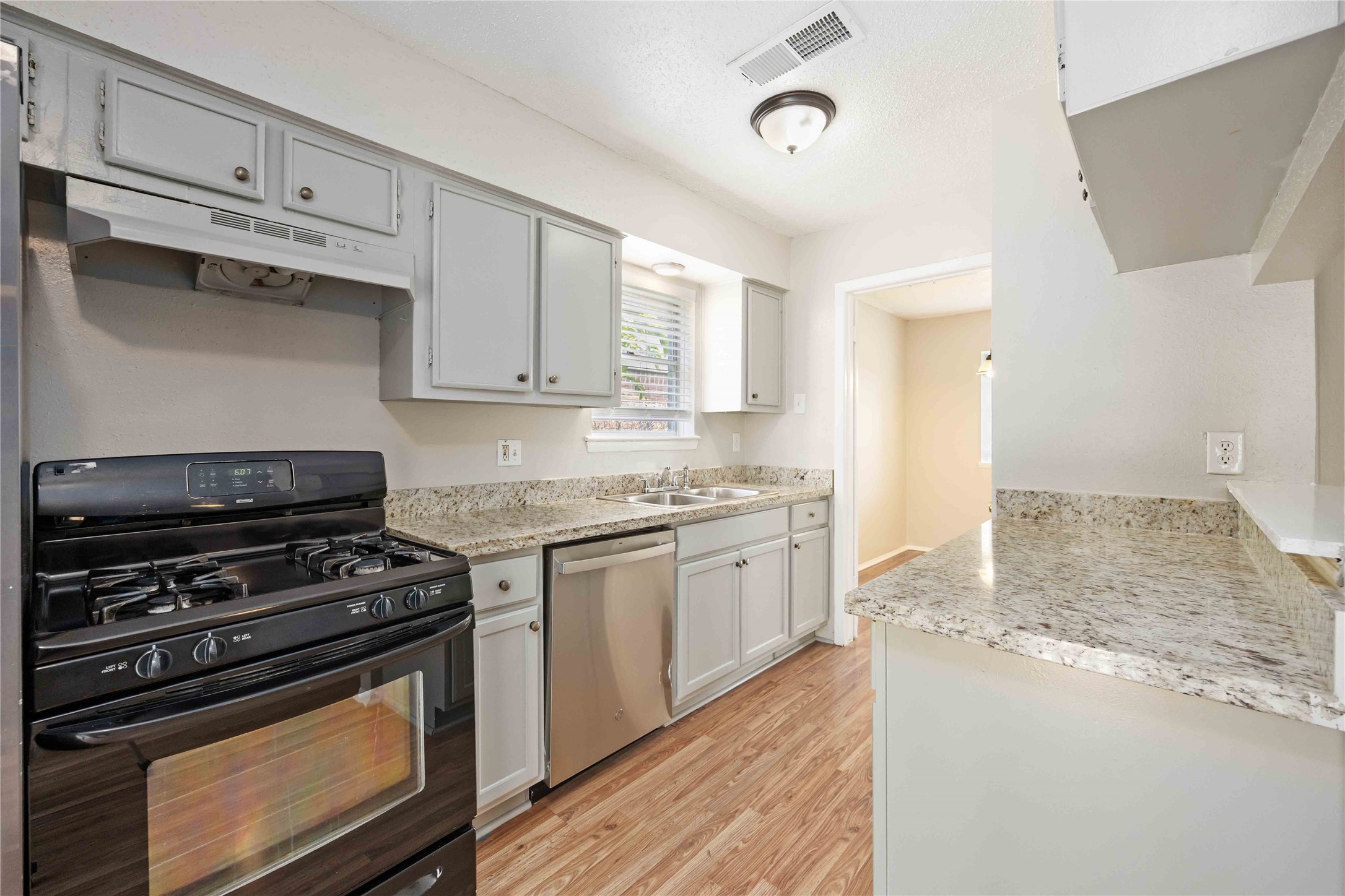 11750 Murr Way Houston, TX 77048 - Photo 12 of 23 a kitchen with stainless steel appliances granite countertop a stove and a granite counter tops