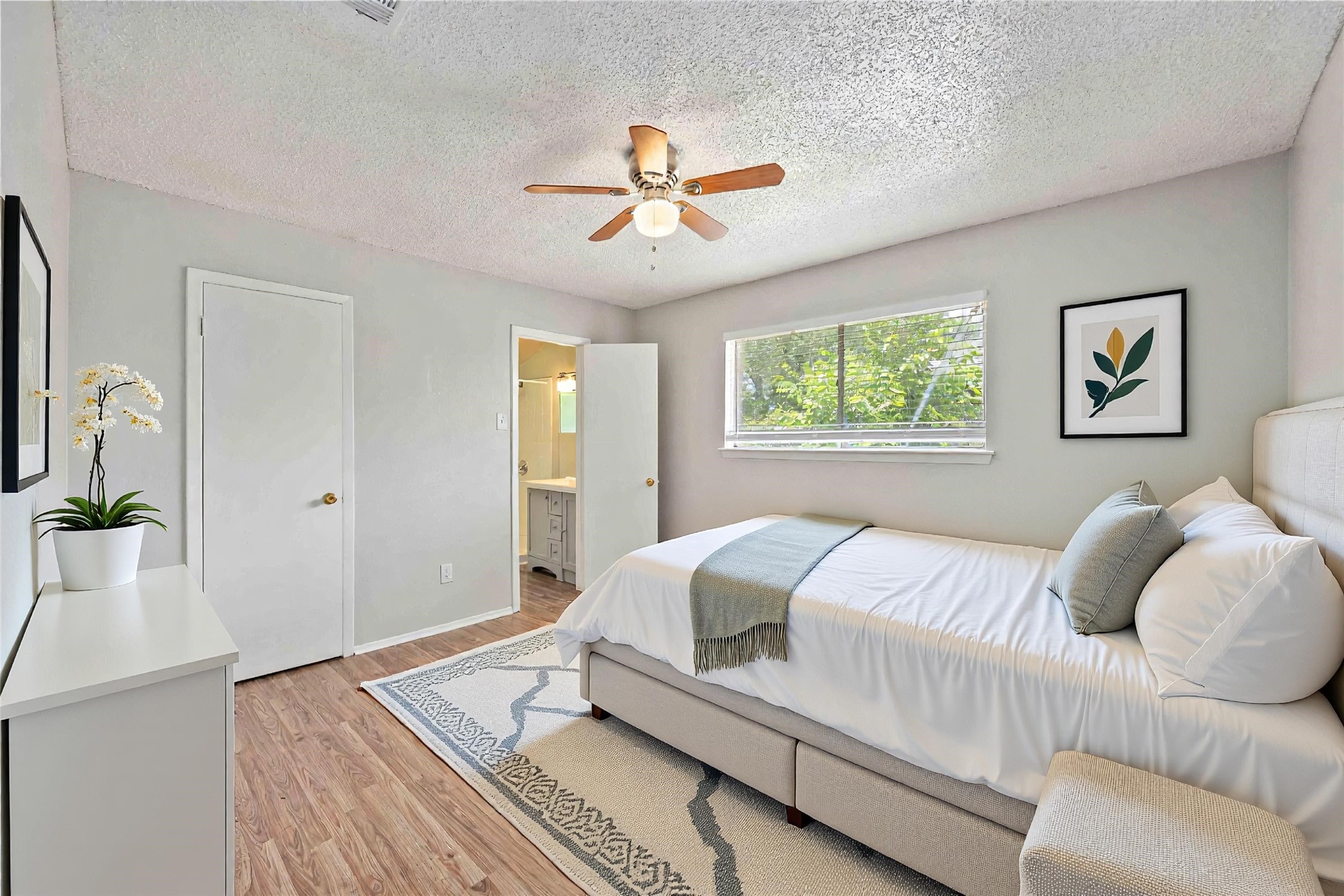 11750 Murr Way Houston, TX 77048 - Photo 13 of 23 a bedroom with a large bed couch and two windows