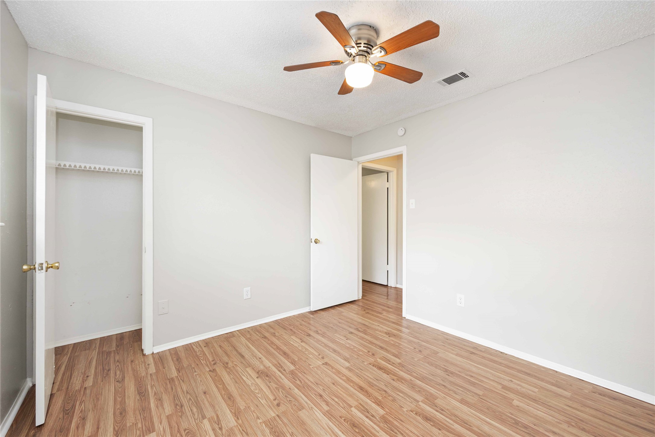 11750 Murr Way Houston, TX 77048 - Photo 18 of 23 a view of an empty room with wooden floor