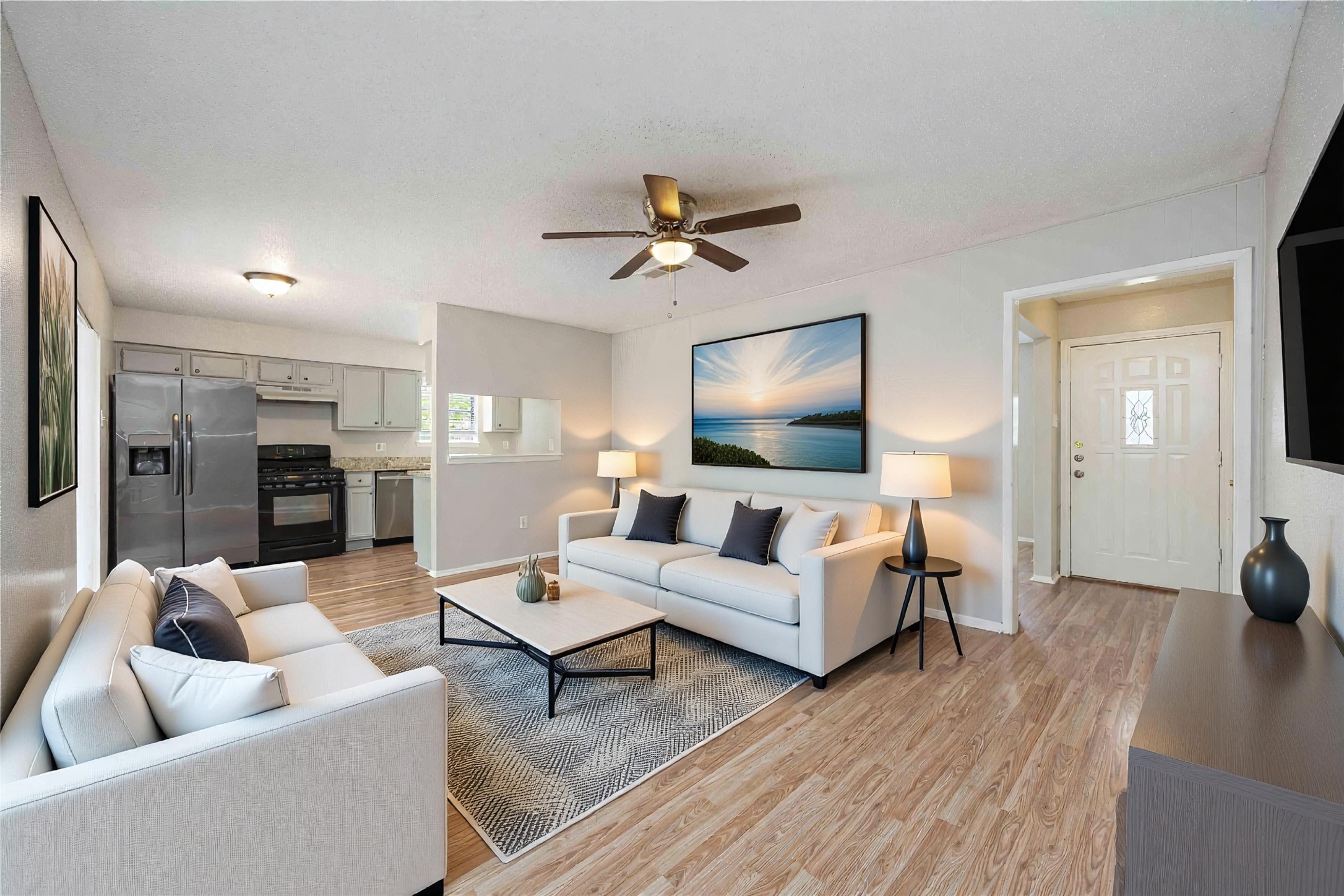 11750 Murr Way Houston, TX 77048 - Photo 5 of 23 a living room with furniture and a flat screen tv