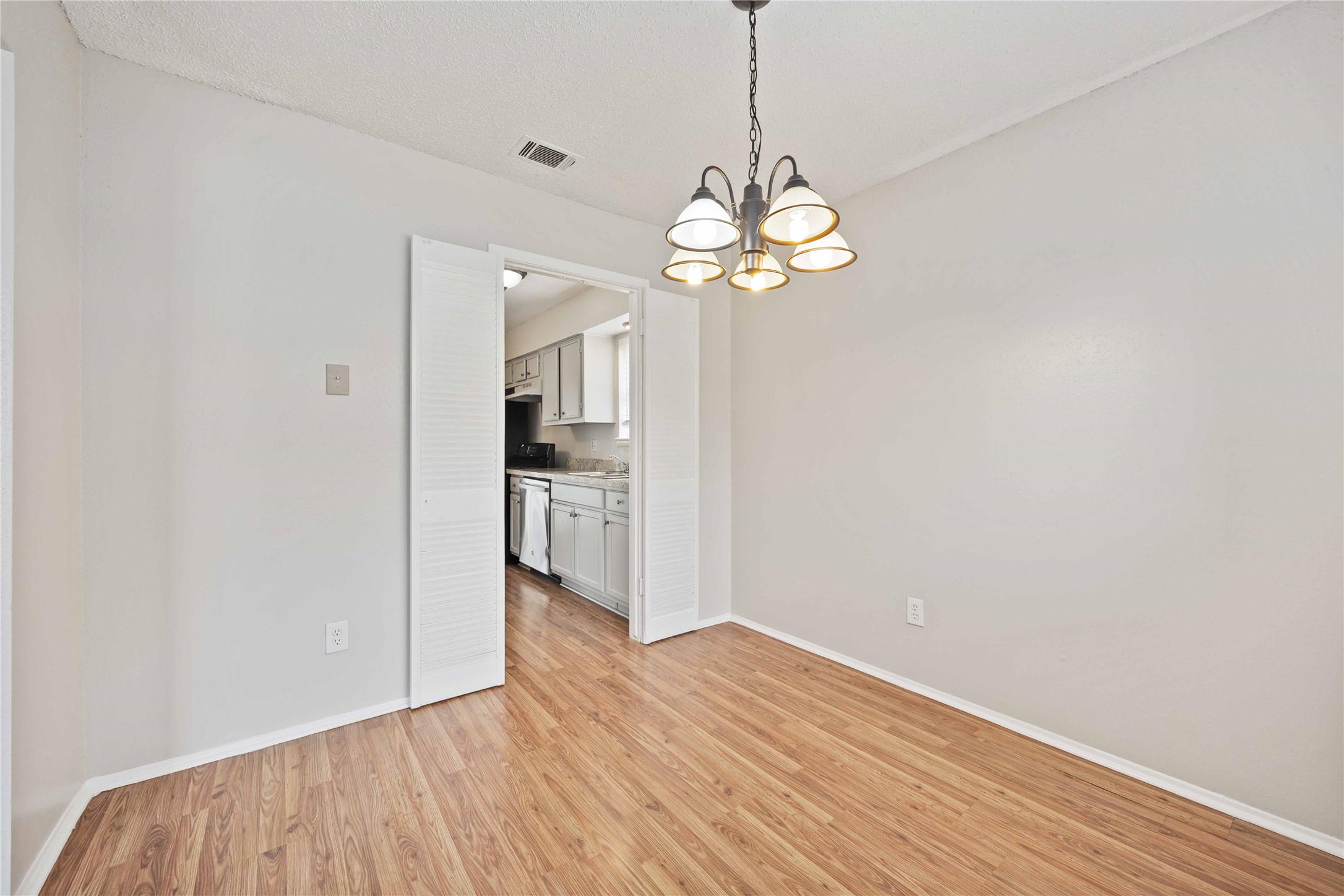 11750 Murr Way Houston, TX 77048 - Photo 8 of 23 a view of a room with wooden floor and kitchen
