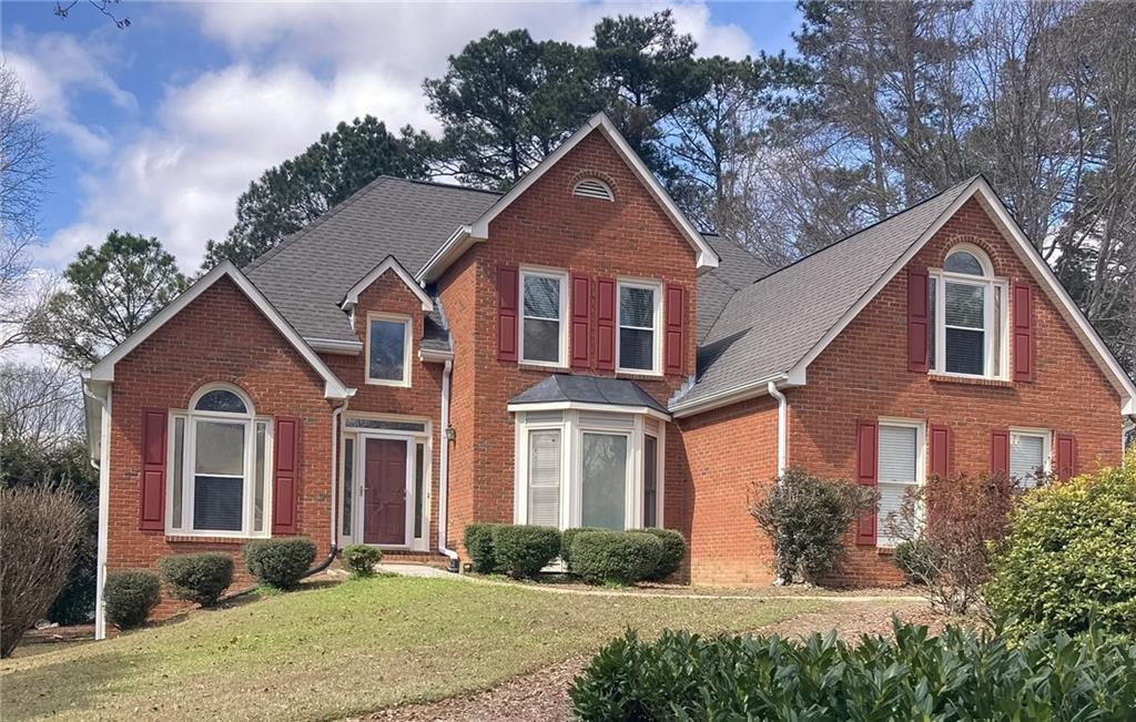 2842 Ashton Tree Place Dacula, GA 30019 - Photo 1 of 1 a front view of a house with garden