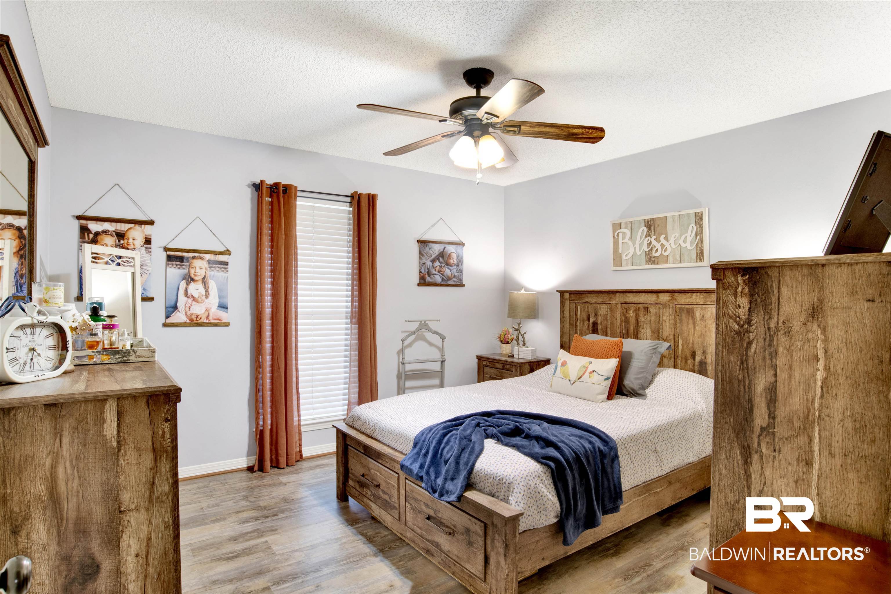 13385 Tom Gaston Road Mobile, AL 36695 - Photo 16 of 42 Bedroom with a textured ceiling, light hardwood / wood-style floors, and ceiling fan