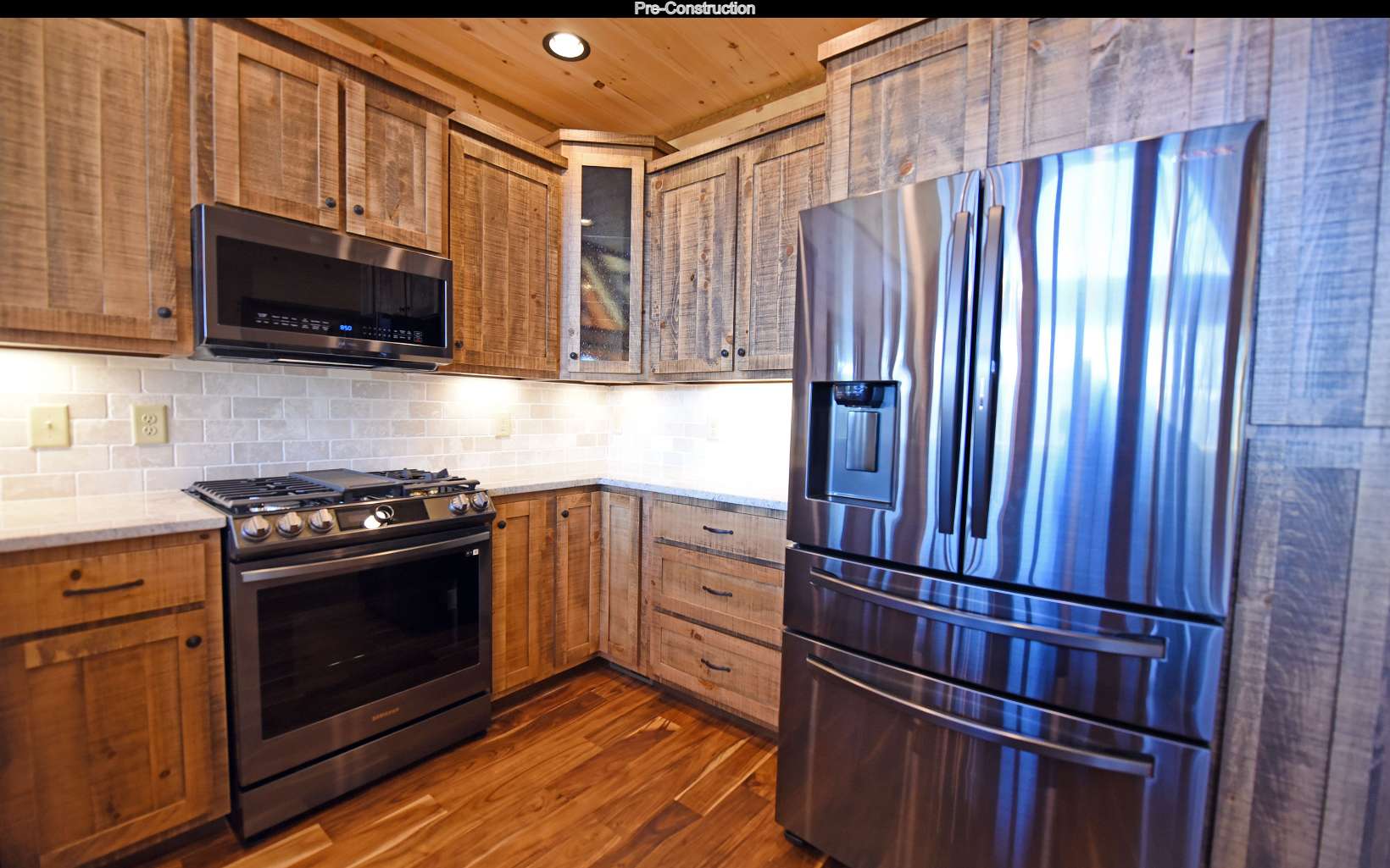 Lot11 Lot11 Native Trail Blue Ridge, GA 30513 - Photo 16 of 44 a kitchen with granite countertop a stove top oven and cabinets