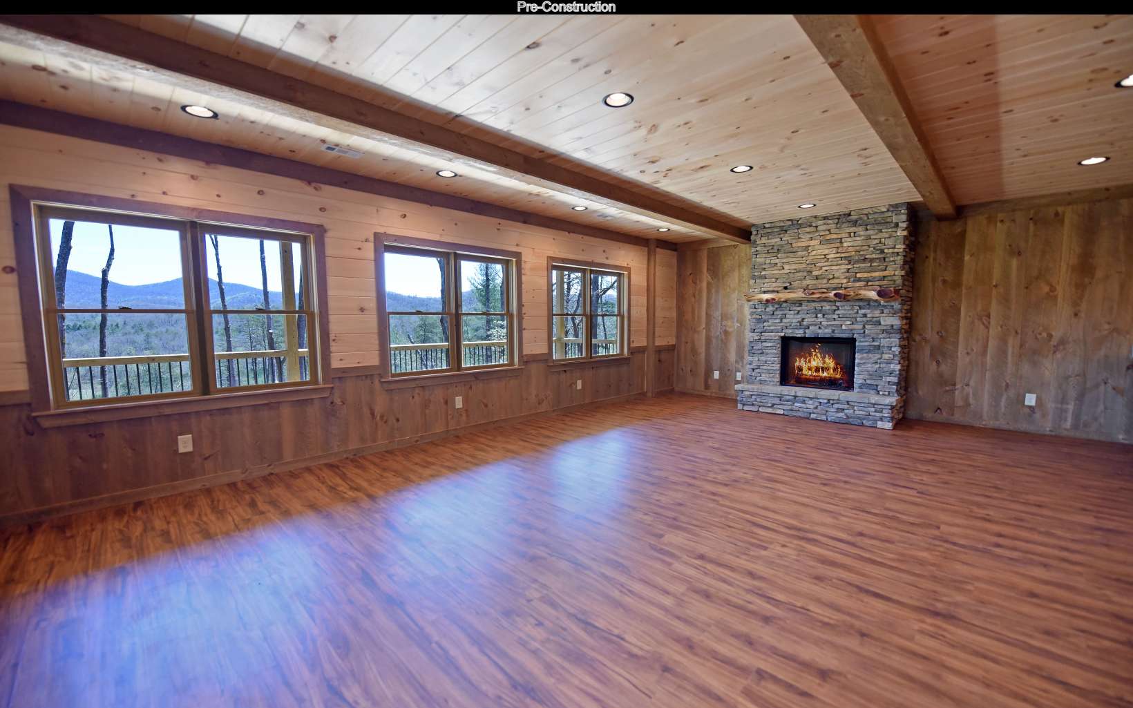 Lot11 Lot11 Native Trail Blue Ridge, GA 30513 - Photo 34 of 44 an empty room with wooden floor fireplace and windows