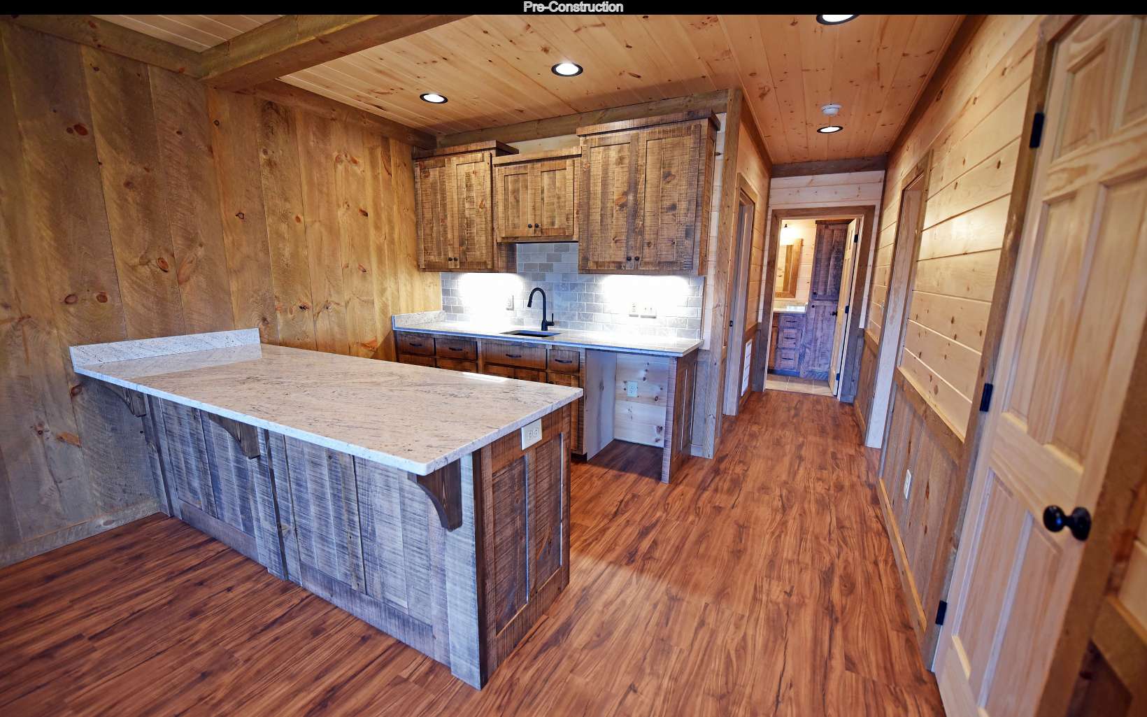 Lot11 Lot11 Native Trail Blue Ridge, GA 30513 - Photo 36 of 44 a kitchen with a wooden floor and chairs