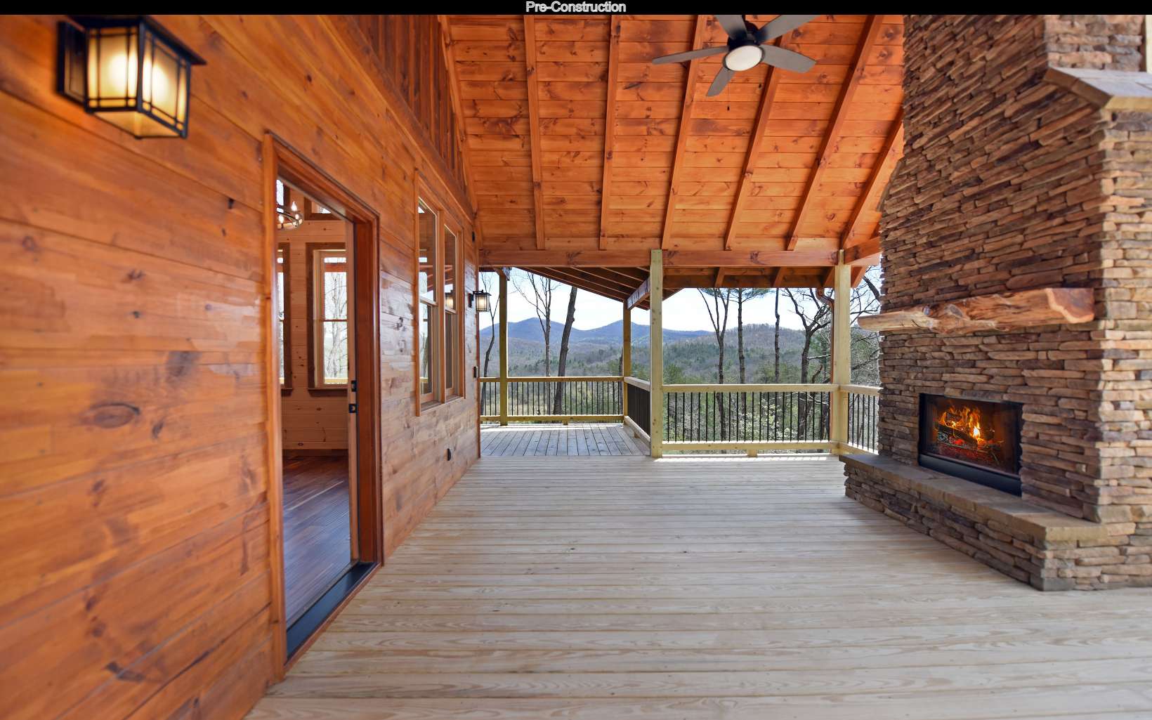 Lot11 Lot11 Native Trail Blue Ridge, GA 30513 - Photo 5 of 44 a view of empty room with wooden floor and fireplace