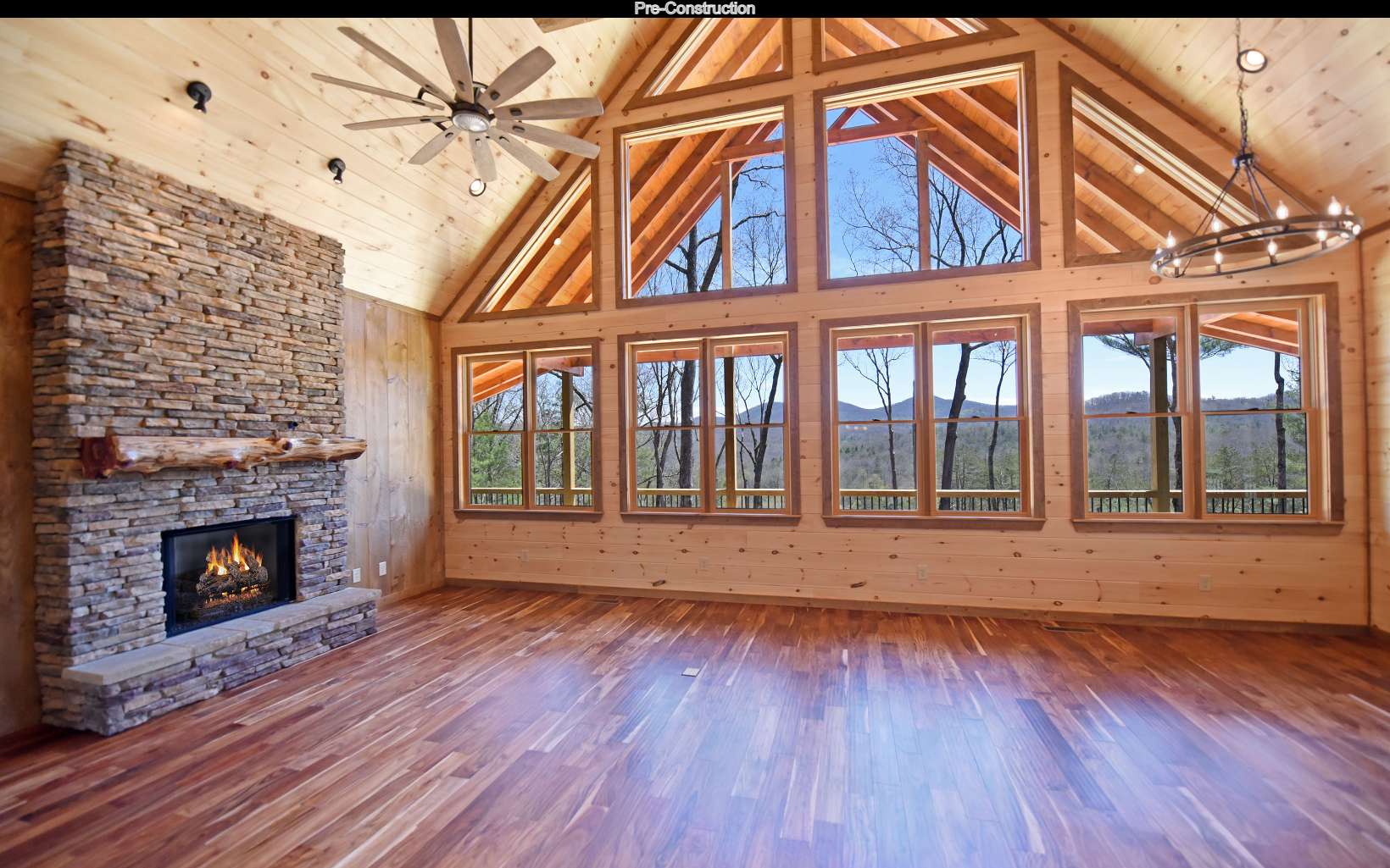 Lot11 Lot11 Native Trail Blue Ridge, GA 30513 - Photo 10 of 44 an empty room with wooden floor fireplace and windows