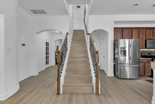 a view of entryway with wooden floor