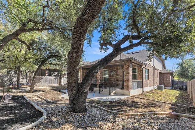 a view of a house with a tree