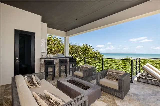 a kitchen with a stove and a wooden floor