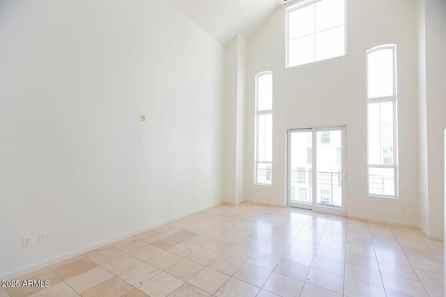 215 East McKinley Street, Unit 408 Phoenix, AZ 85004 - Photo 4 of 19 a view of an empty room with a window