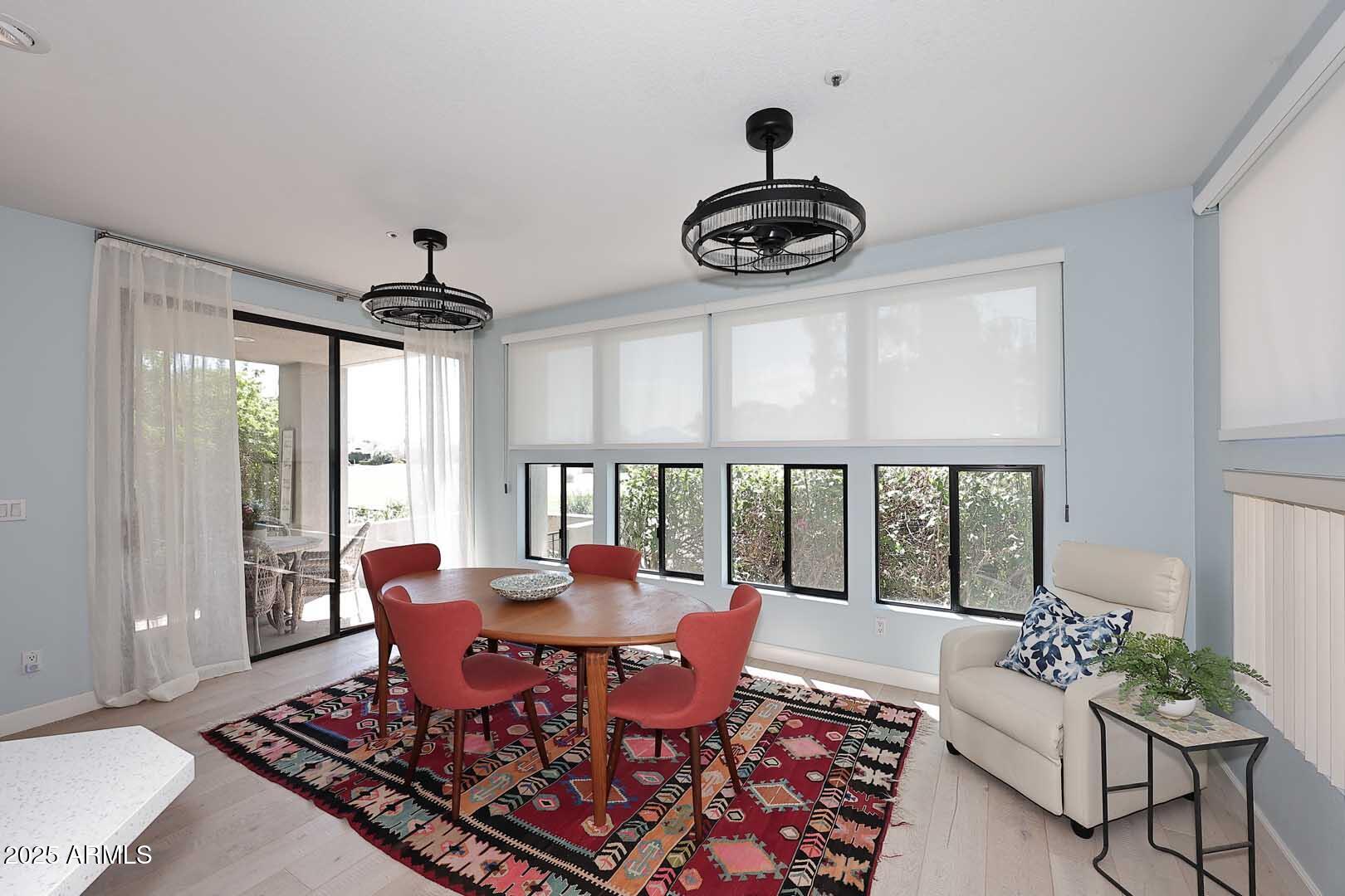 7700 East Gainey Ranch Road, Unit 128 Scottsdale, AZ 85258 - Photo 11 of 60 a living room with furniture and wooden floor