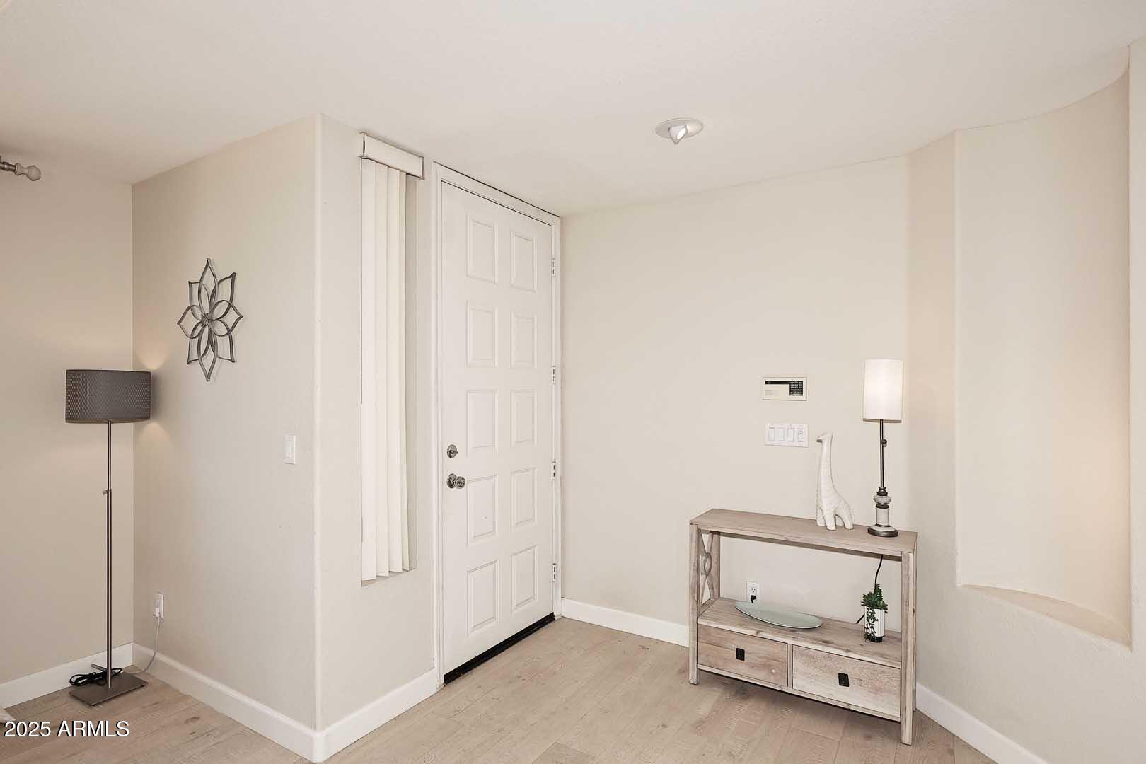 7700 East Gainey Ranch Road, Unit 128 Scottsdale, AZ 85258 - Photo 17 of 60 a room with a table and a chair