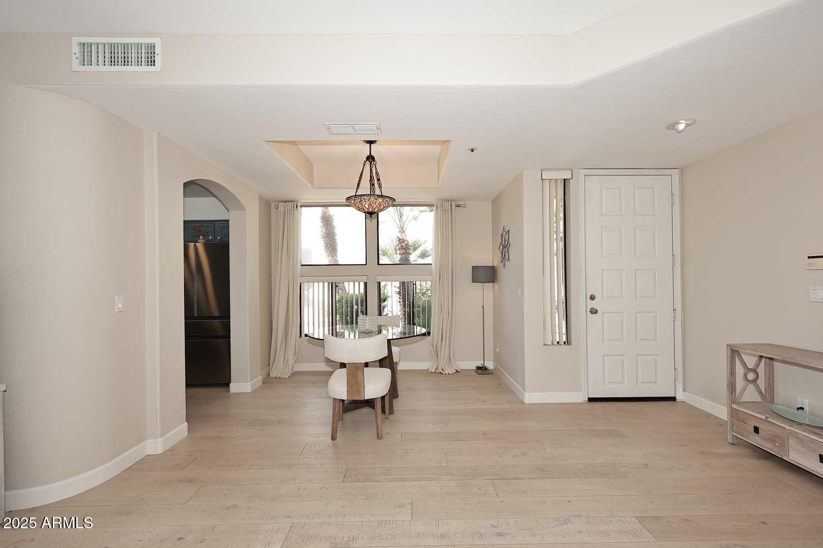 7700 East Gainey Ranch Road, Unit 128 Scottsdale, AZ 85258 - Photo 18 of 60 a living room with furniture