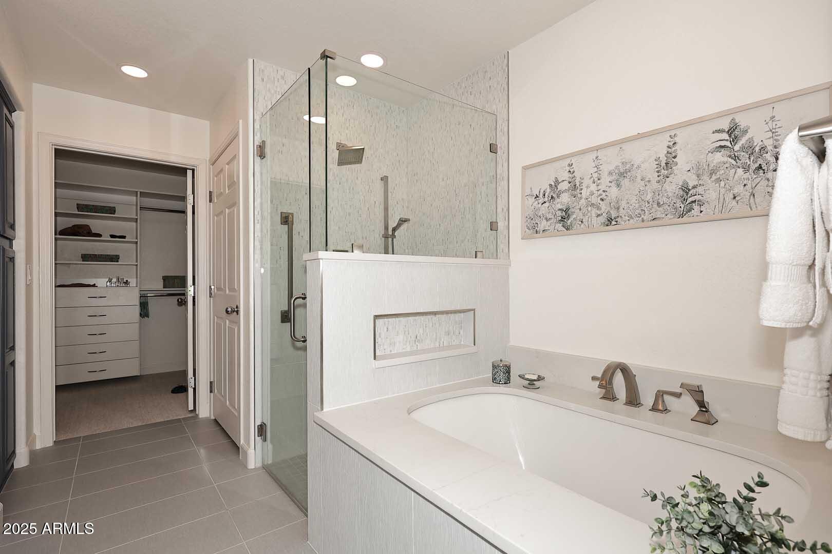 7700 East Gainey Ranch Road, Unit 128 Scottsdale, AZ 85258 - Photo 22 of 60 a bathroom with a sink and a mirror