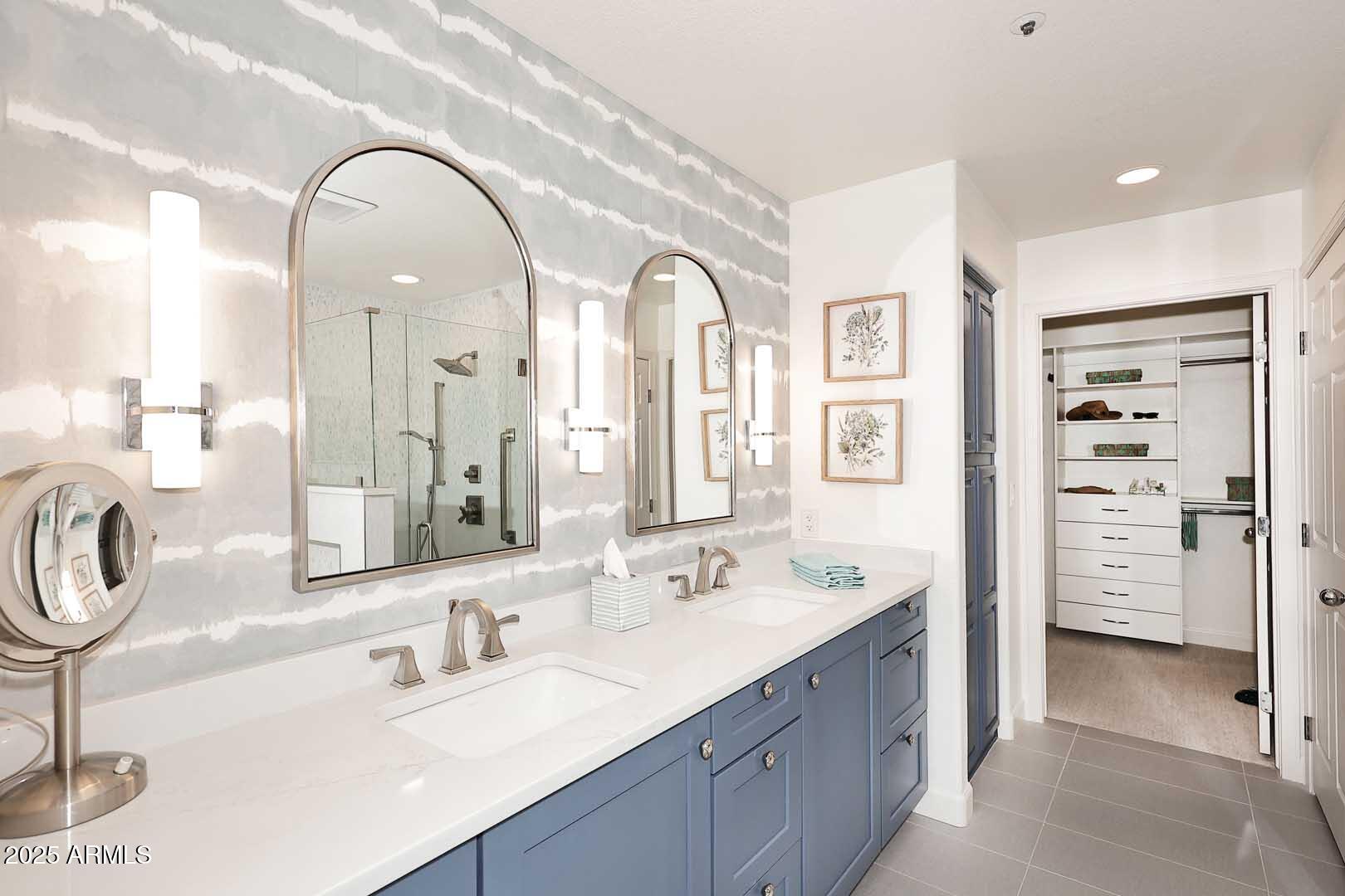 7700 East Gainey Ranch Road, Unit 128 Scottsdale, AZ 85258 - Photo 23 of 60 a spacious bathroom with a double vanity sink mirror and double