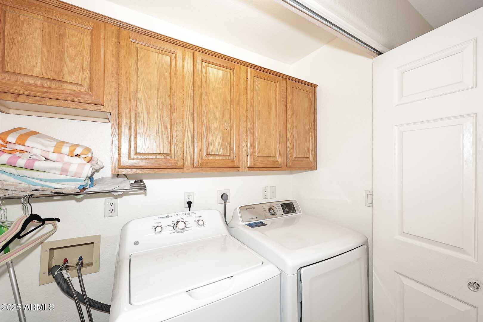 7700 East Gainey Ranch Road, Unit 128 Scottsdale, AZ 85258 - Photo 35 of 60 a utility room with dryer and washer