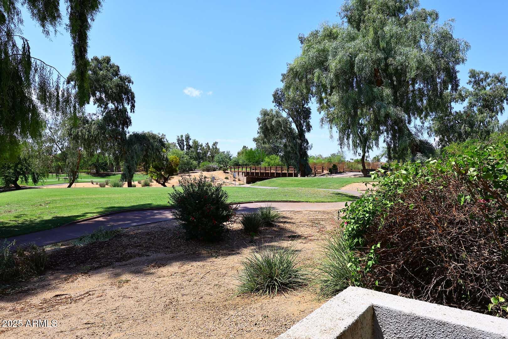 7700 East Gainey Ranch Road, Unit 128 Scottsdale, AZ 85258 - Photo 36 of 60 a view of a park with large trees