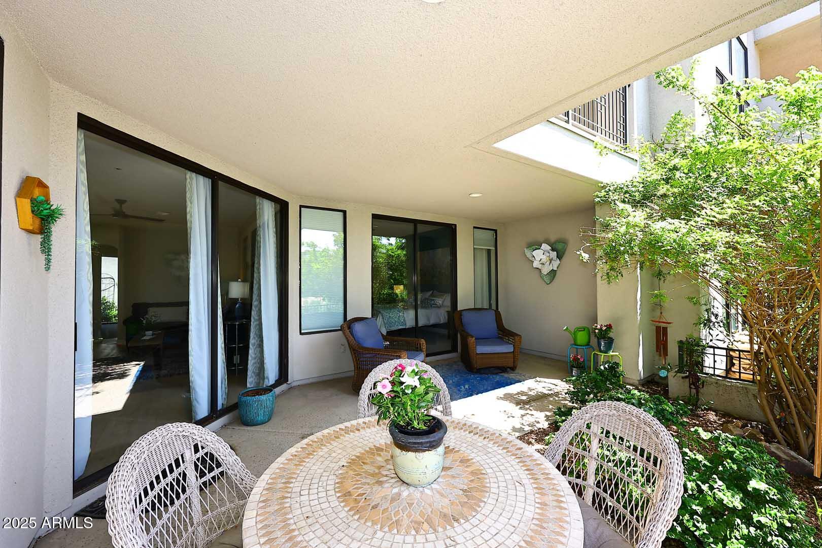 7700 East Gainey Ranch Road, Unit 128 Scottsdale, AZ 85258 - Photo 39 of 60 a bed room with a bed and a potted plant