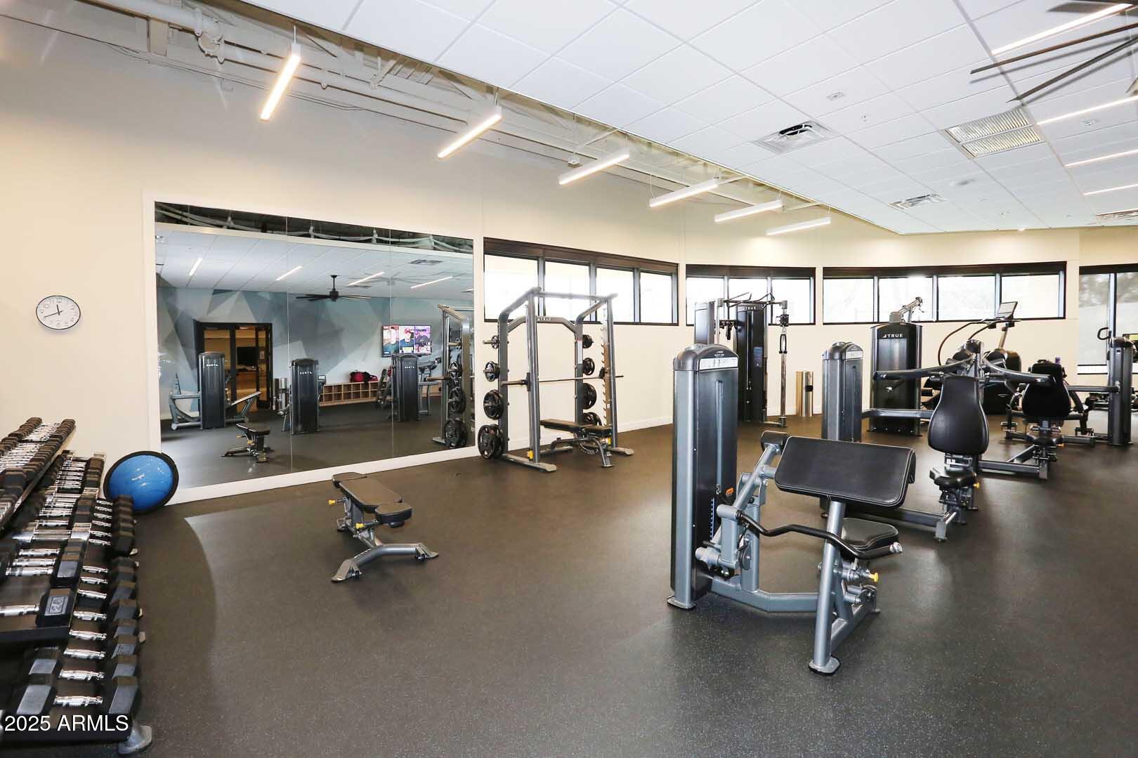 7700 East Gainey Ranch Road, Unit 128 Scottsdale, AZ 85258 - Photo 54 of 60 a view of a room with gym equipment