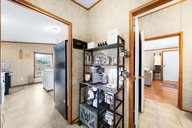a view of a hallway with living room and furniture