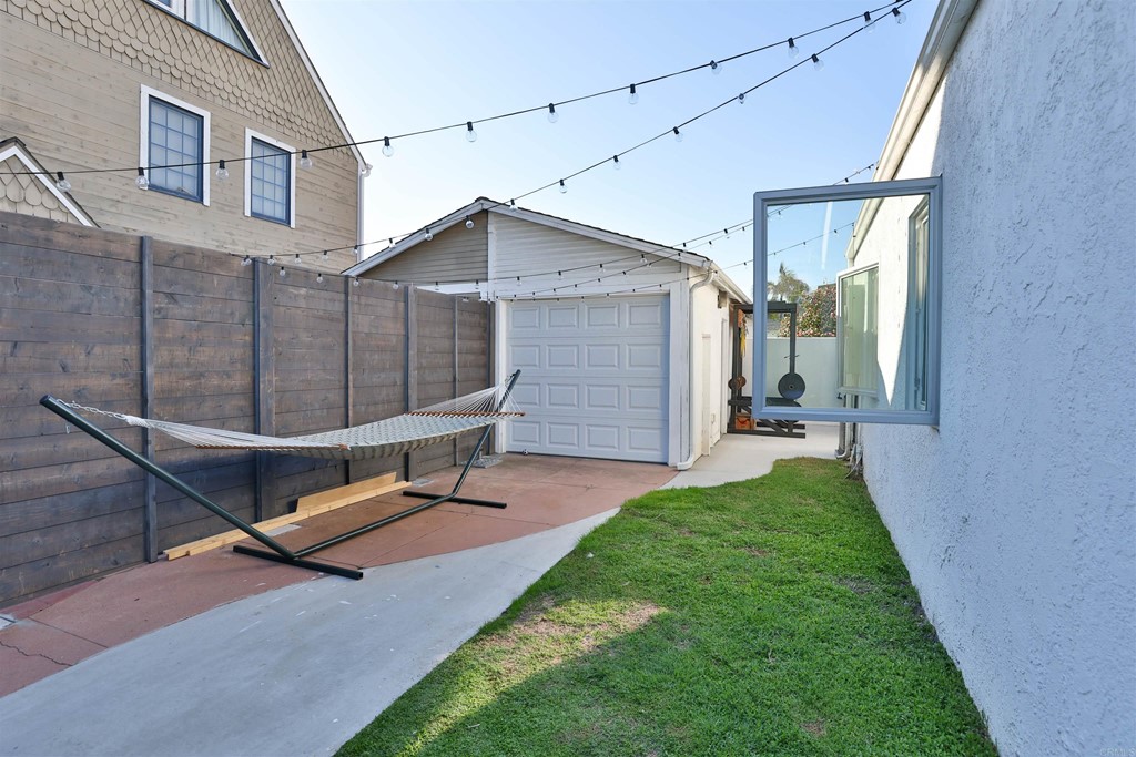 1116 Third Street Coronado, CA 92118 - Photo 23 of 33 a backyard of a house with table and chairs