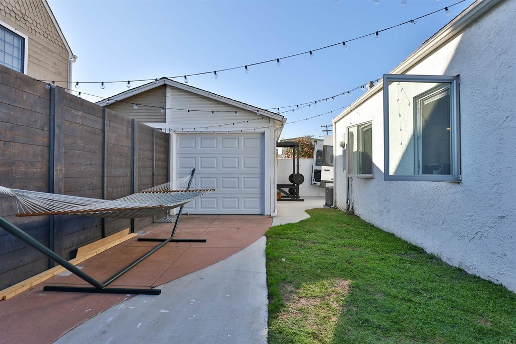 1116 Third Street Coronado, CA 92118 - Photo 24 of 33 a backyard of a house with table and chairs
