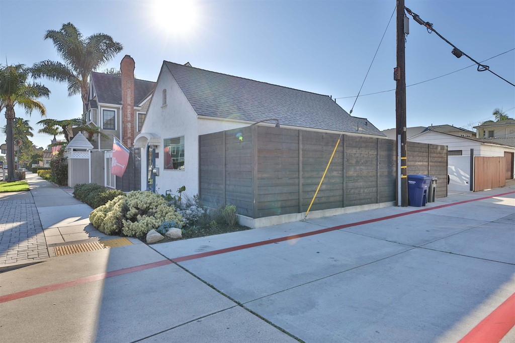 1116 Third Street Coronado, CA 92118 - Photo 29 of 33 a view of a house with a yard and potted plants
