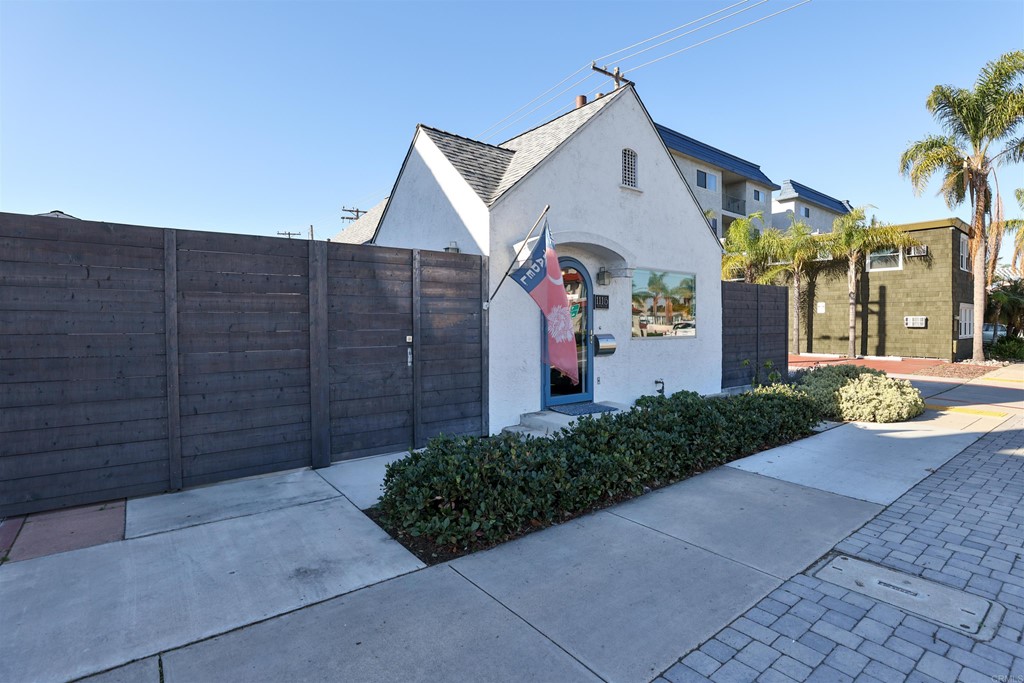 1116 Third Street Coronado, CA 92118 - Photo 33 of 33 a front view of a house with a yard