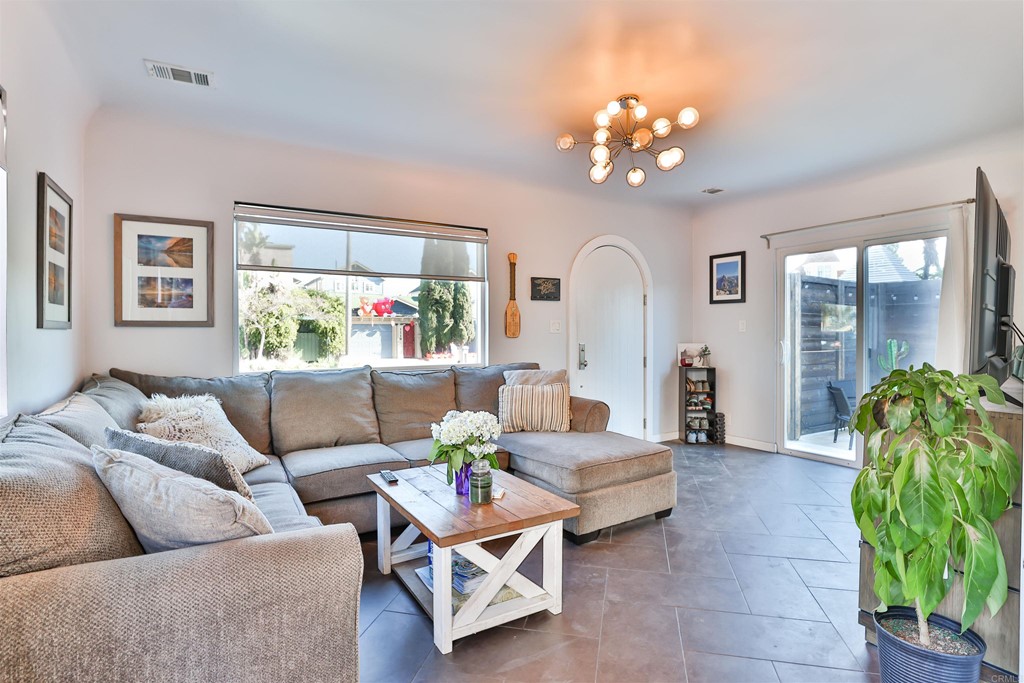 1116 Third Street Coronado, CA 92118 - Photo 7 of 33 a living room with furniture and a chandelier