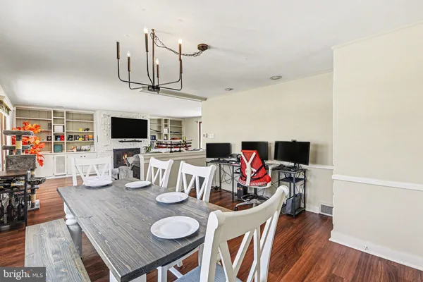 a living room with furniture and flat screen tv