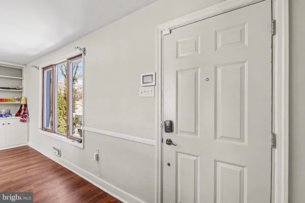 a view of an entryway with wooden floor