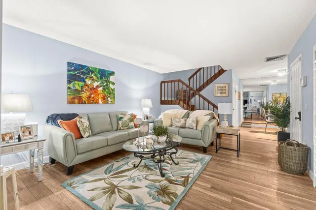 a living room with furniture or couch and a wooden floor