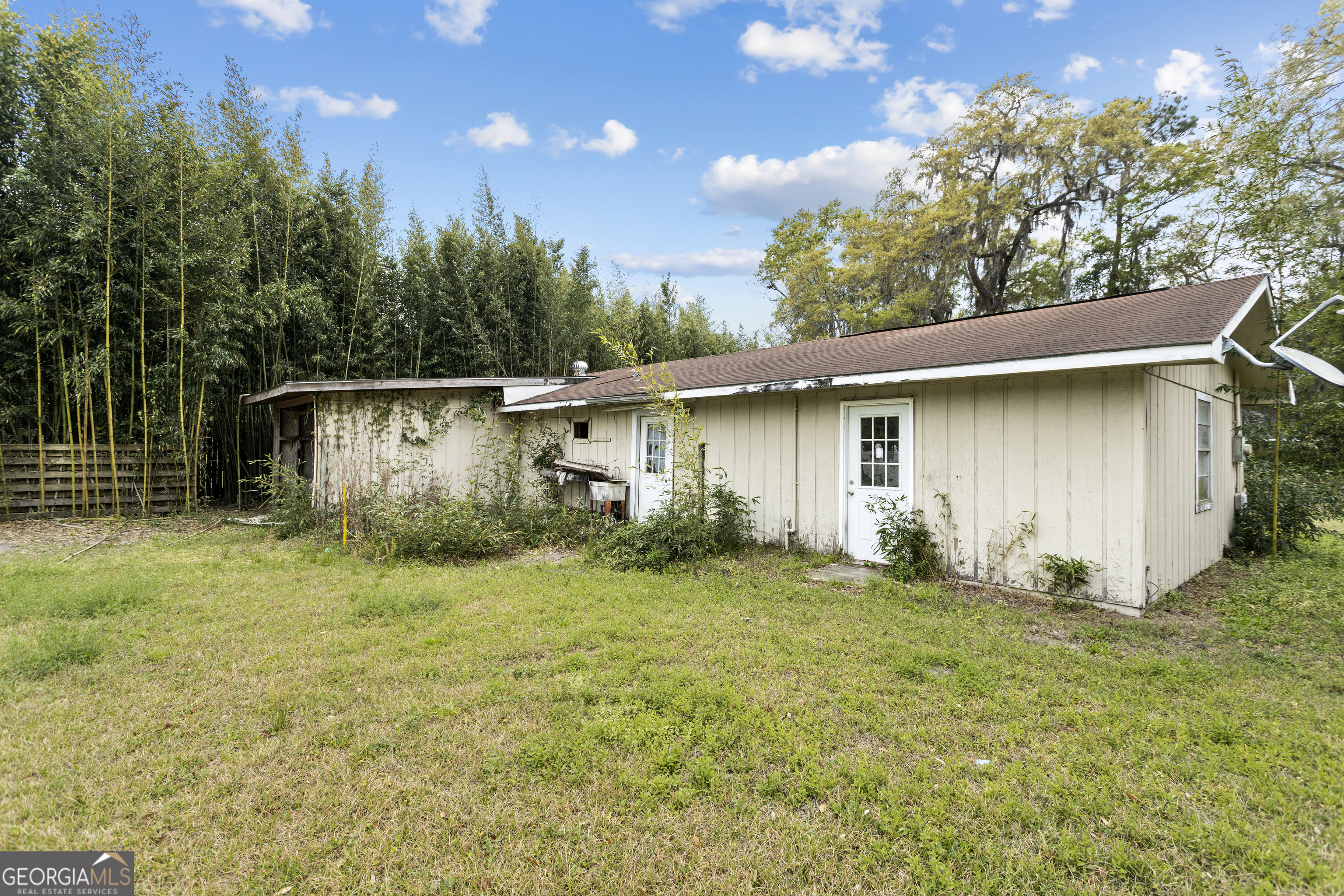 160 Hall Street Hinesville, GA 31313 - Photo 18 of 34 a view of a house with a yard