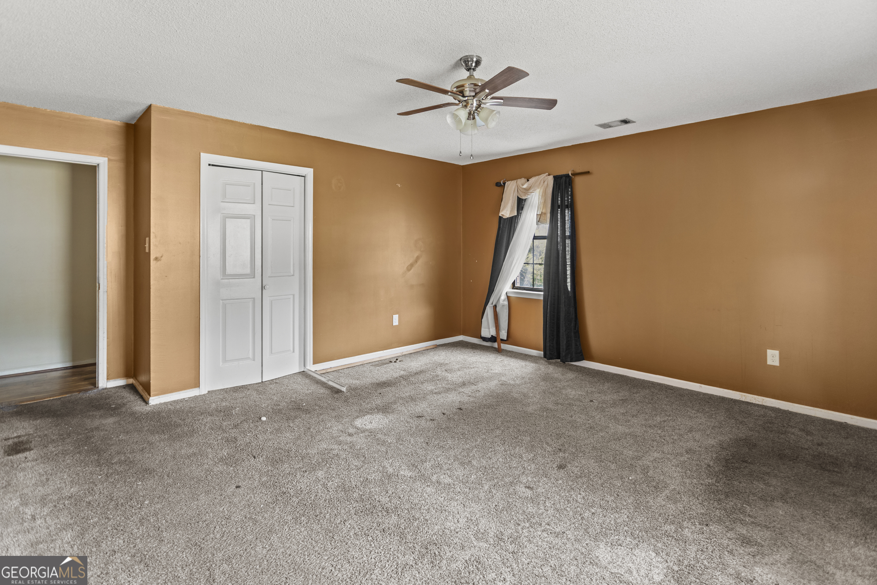 160 Hall Street Hinesville, GA 31313 - Photo 21 of 34 a view of an empty room with a ceiling fan