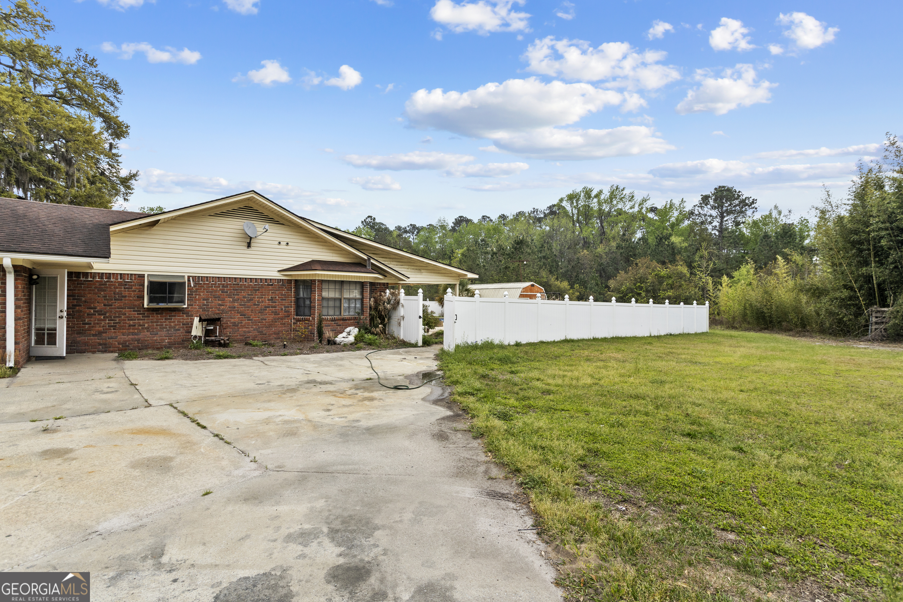 160 Hall Street Hinesville, GA 31313 - Photo 3 of 34 a front view of a house with a yard