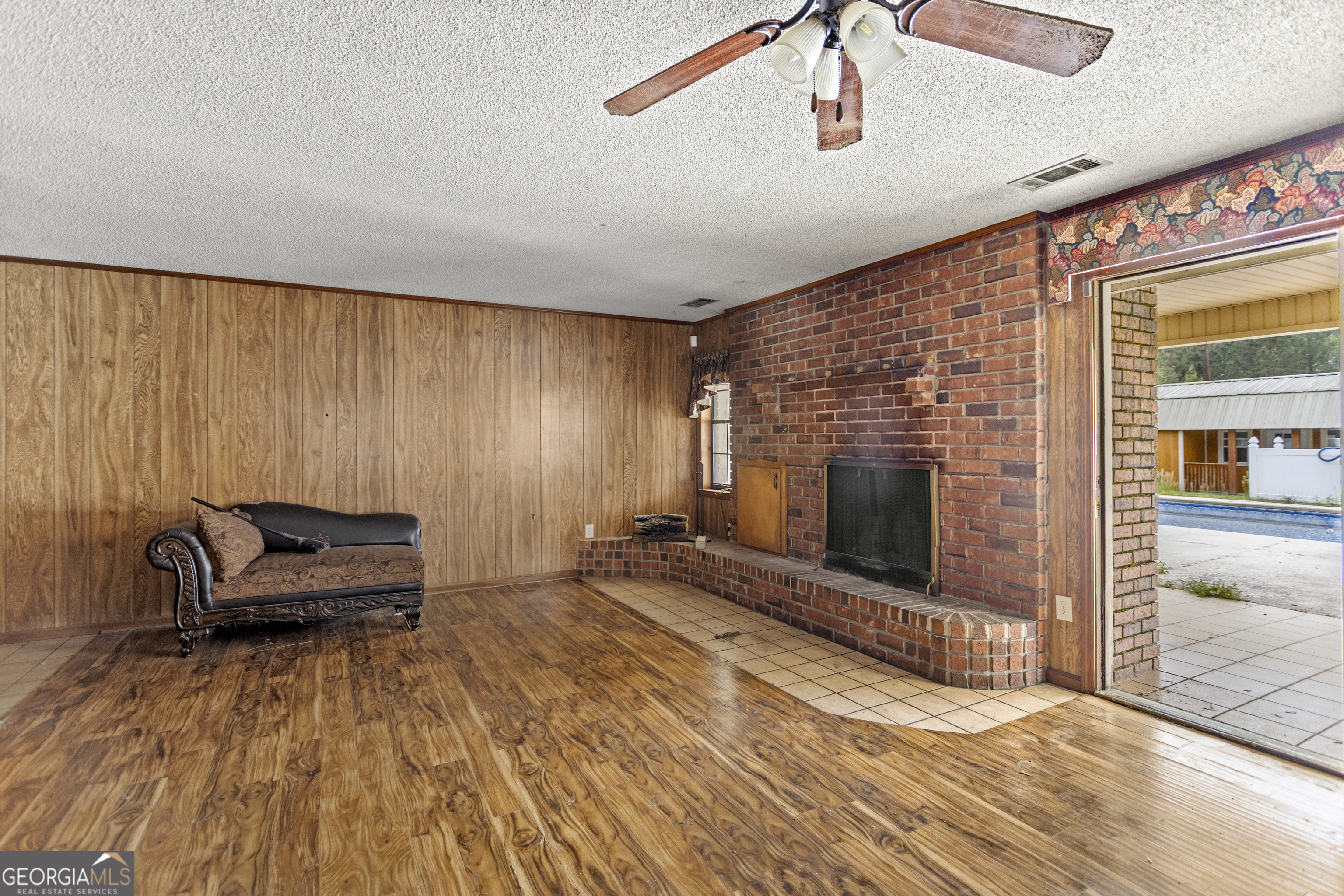 160 Hall Street Hinesville, GA 31313 - Photo 5 of 34 a view of a livingroom with furniture and a fireplace