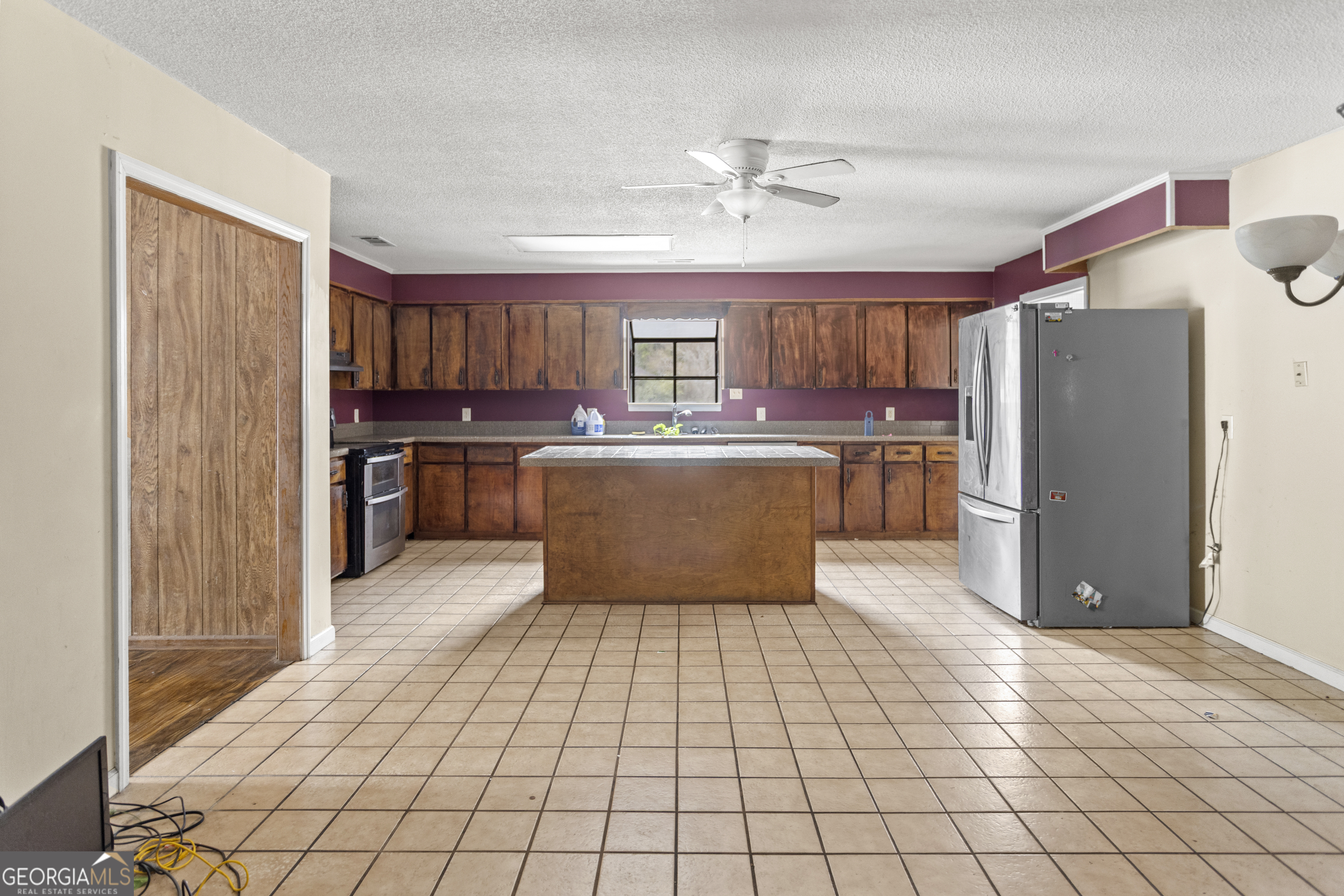 160 Hall Street Hinesville, GA 31313 - Photo 6 of 34 a kitchen with stainless steel appliances granite countertop a refrigerator and a stove top oven