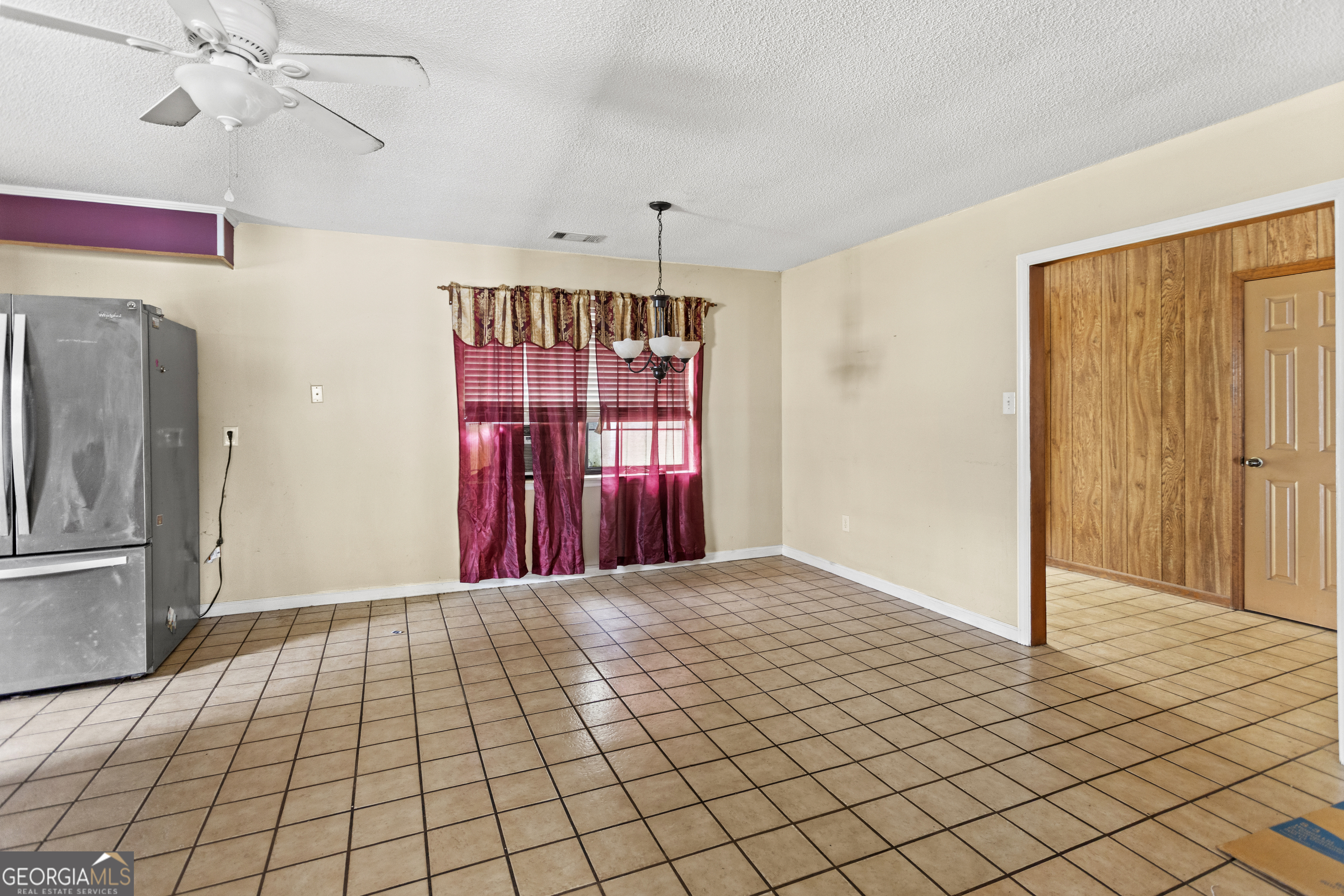 160 Hall Street Hinesville, GA 31313 - Photo 8 of 34 a view of empty room with wooden floor and fan