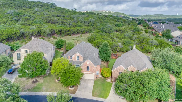 an aerial view of a house with a garden