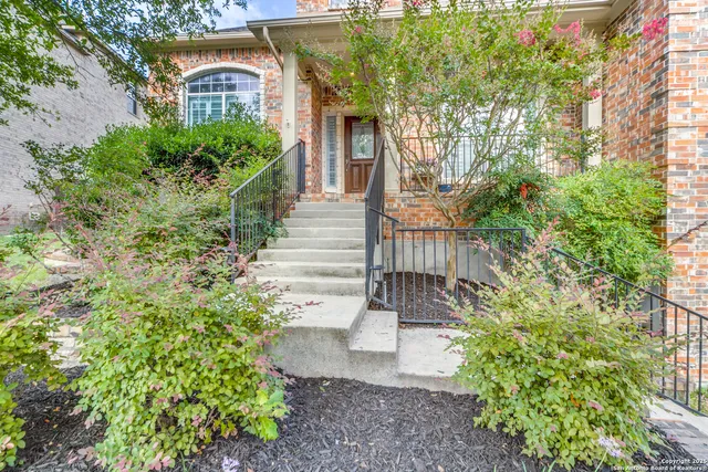a view of a house with a yard and plants