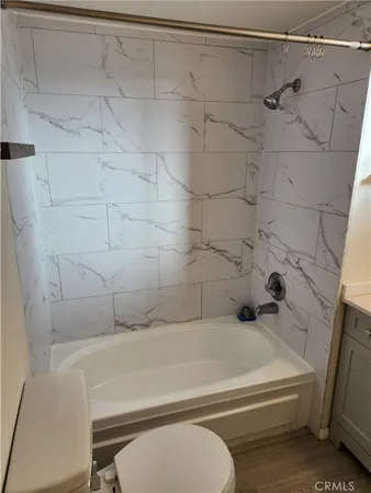 a bathroom with a tub and a shower